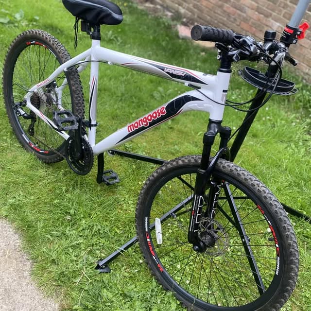 White and black mountain bike fresh off the repair stand