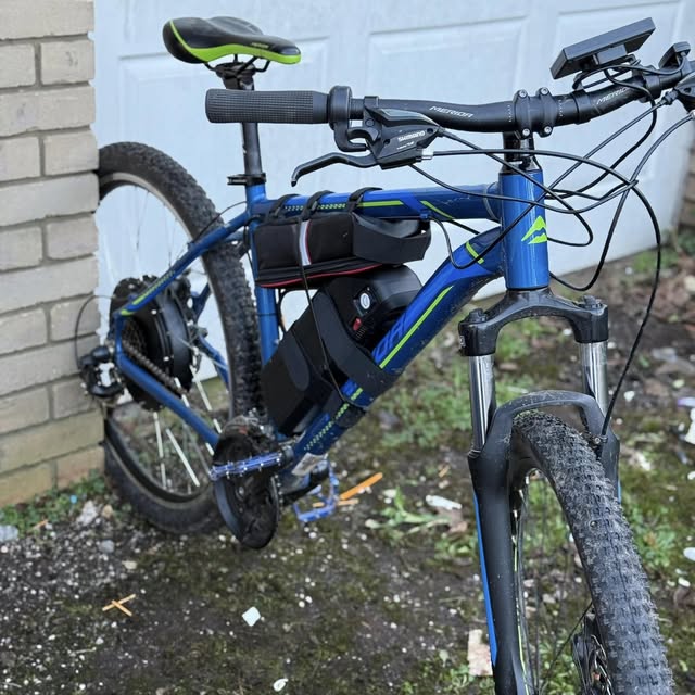 Electric mountain bike with mid-drive motor and battery, checked over by JJW
